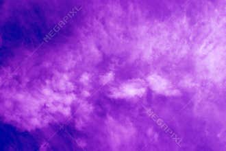 Special recycled purple paper held lit up with sunlight