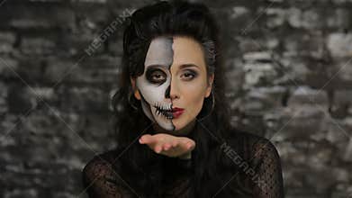 Woman blowing a kiss