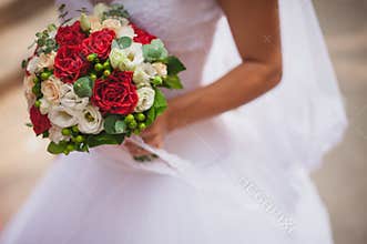 Bride with a red wedding bouquet