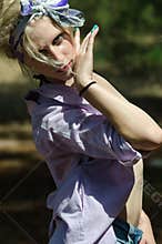 Woman in bra bikini, shirt and bandana in the forest