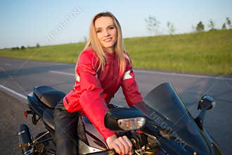 Biker woman sitting on a motorcycle
