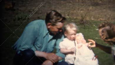 (8mm Vintage) 1952 Dad Mom & Baby Farm Picnic, Chickens In Background. Iowa, USA.