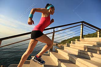 Healthy lifestyle sports woman running up on stone stairs sunrise
