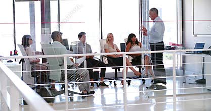 People Attending Business Meeting In Modern Open Plan Office