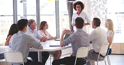 People Attending Business Meeting In Modern Open Plan Office