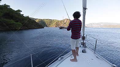 Man fishing from the sail boat