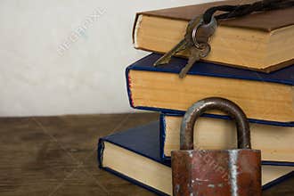 Stack of old big books and lock