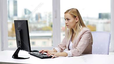 Young businesswoman with computer typing at office