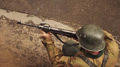 German soldier of war world two shoots from mashinegun in slow motion