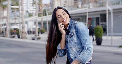 Happy casual young woman swinging her hair
