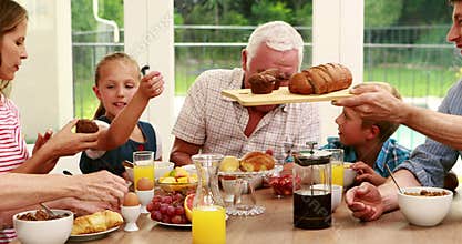 Happy family having breakfast together