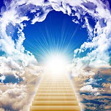 Stairway leading up to bright light
