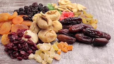 Close up photo of raw nuts and dried fruits