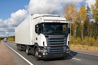white truck on country highway