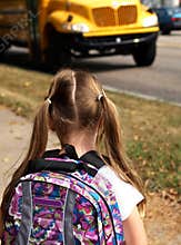 Girl waiting for school bus