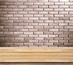 Empty wood table and red brick wall in background. product display template.