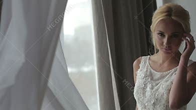 Beautiful bride posing in her wedding dress