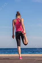Fit healthy woman athlete stretching