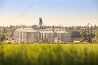 Panorama of modern metal silo in countryside
