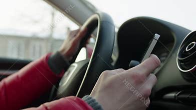 Woman Texting while Driving a Car