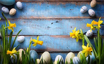 Art easter Background with easter eggs and spring flowers
