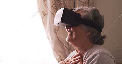Senior woman wearing virtual reality headset