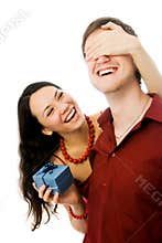 Young woman gives a present to her husband
