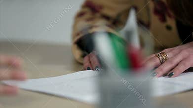 Close up shot of hands and documents at business meeting with CEO and employee