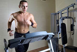 Man running at gym