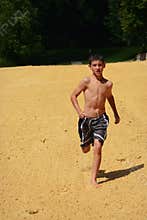 Boy Running in Sand