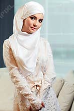 Beautiful Muslim woman in a white wedding dress