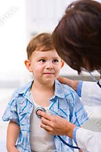 Doctor examining child