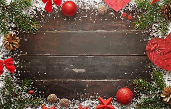 Wooden table with christmas decorations. Top view of board with free space for greeting text