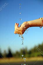 Fresh water falling on children hands