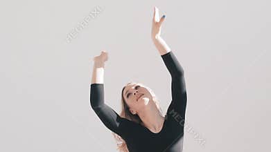 Hand movement of ballet dancer on a white background. Elegant ballerina. Touch your fingers with tenderness and