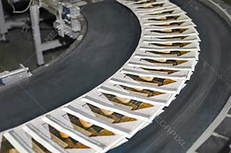 Magazines on conveyor belt in print plant