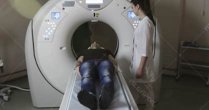 4K Doctor pushing buttons on mri tomograph.