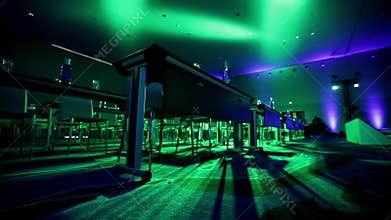 Bottles with water and white sheets on tables and red chairs in meeting hall