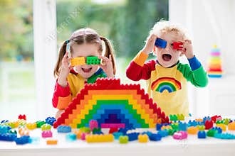 Kids playing with colorful blocks
