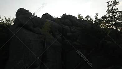 Aerial over the mountains rock sunrise Dovbysh/ aerial cinematography camera up