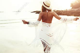 Boho styled model on the beach