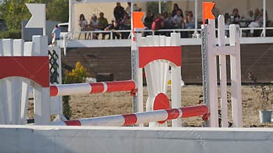 Close up of horse jumps through a barrier. Slow motion