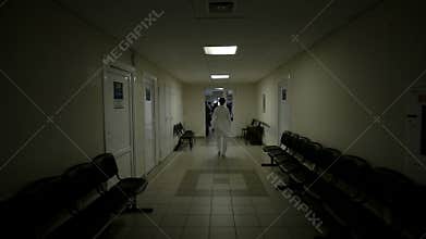 Doctor walking at hospital corridor