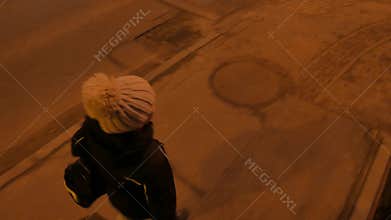 Lonely girl walking at night. Night city, 4K UHD