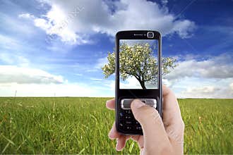 Woman taking photo with mobile cell phone