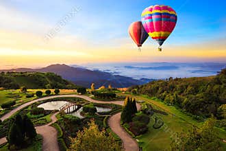 Colorful hot-air balloons flying over the mountain