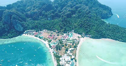 Aerial drone video of iconic tropical beach and resorts of Phi Phi island