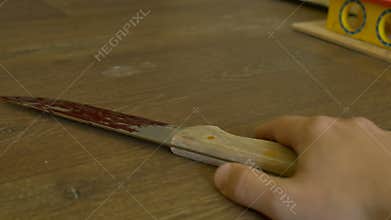 Dead man with bloody knife