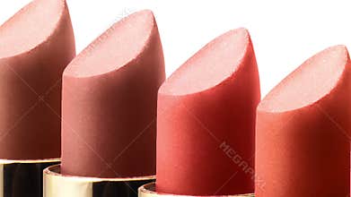 Colored lipstick color in a row on white background macro