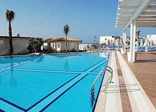 Blue pool, white tent in a Turkish hotel Sirius Deluxe.